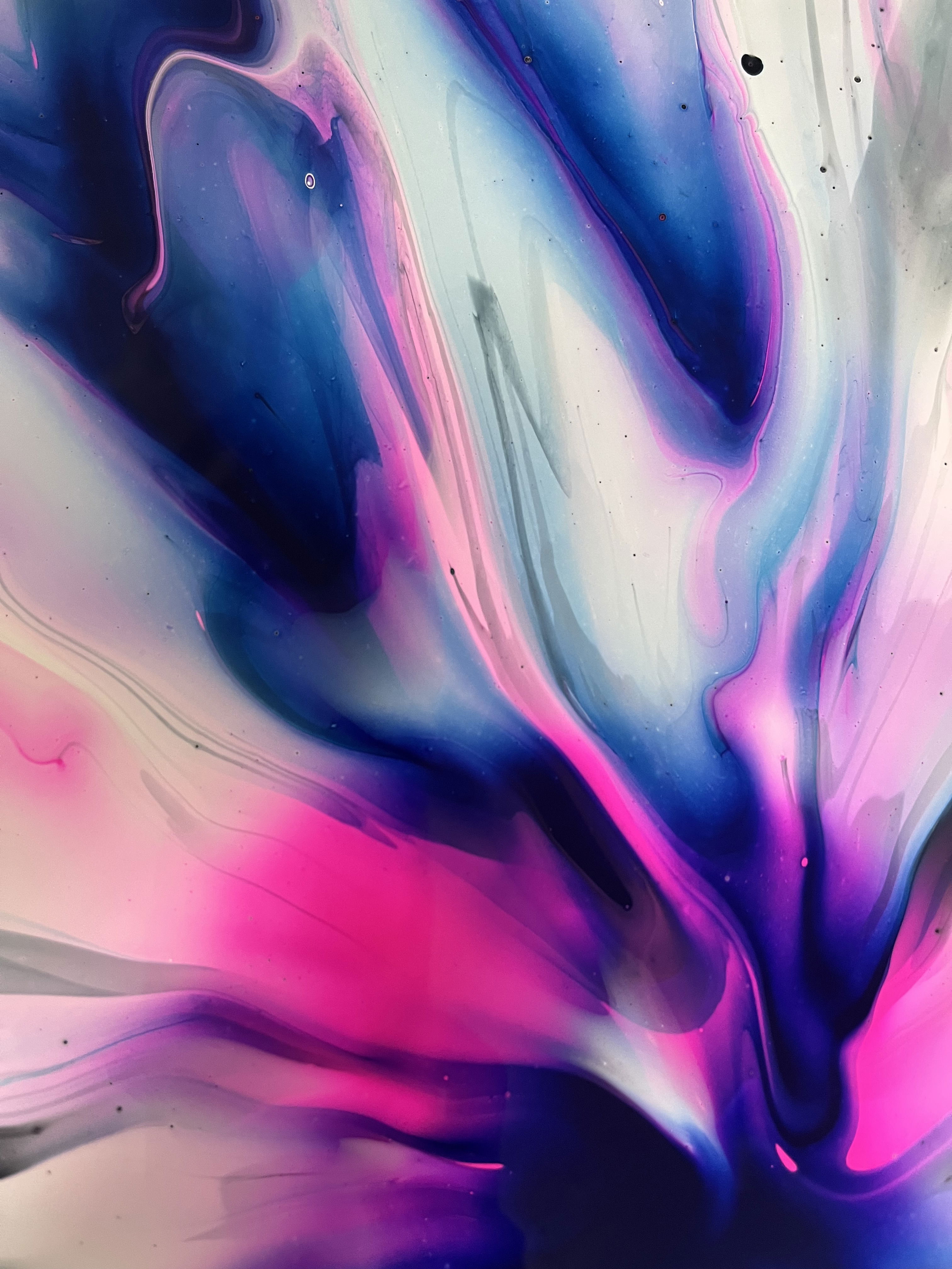 Abstract acrylic on canvas bursts with cerulean and magenta swirls, evoking an ethereal cosmos. The fluid play of colors creates a luminous, swirling vortex of depth. Artwork style is Abstrakt and technique Acryl auf Leinwand.