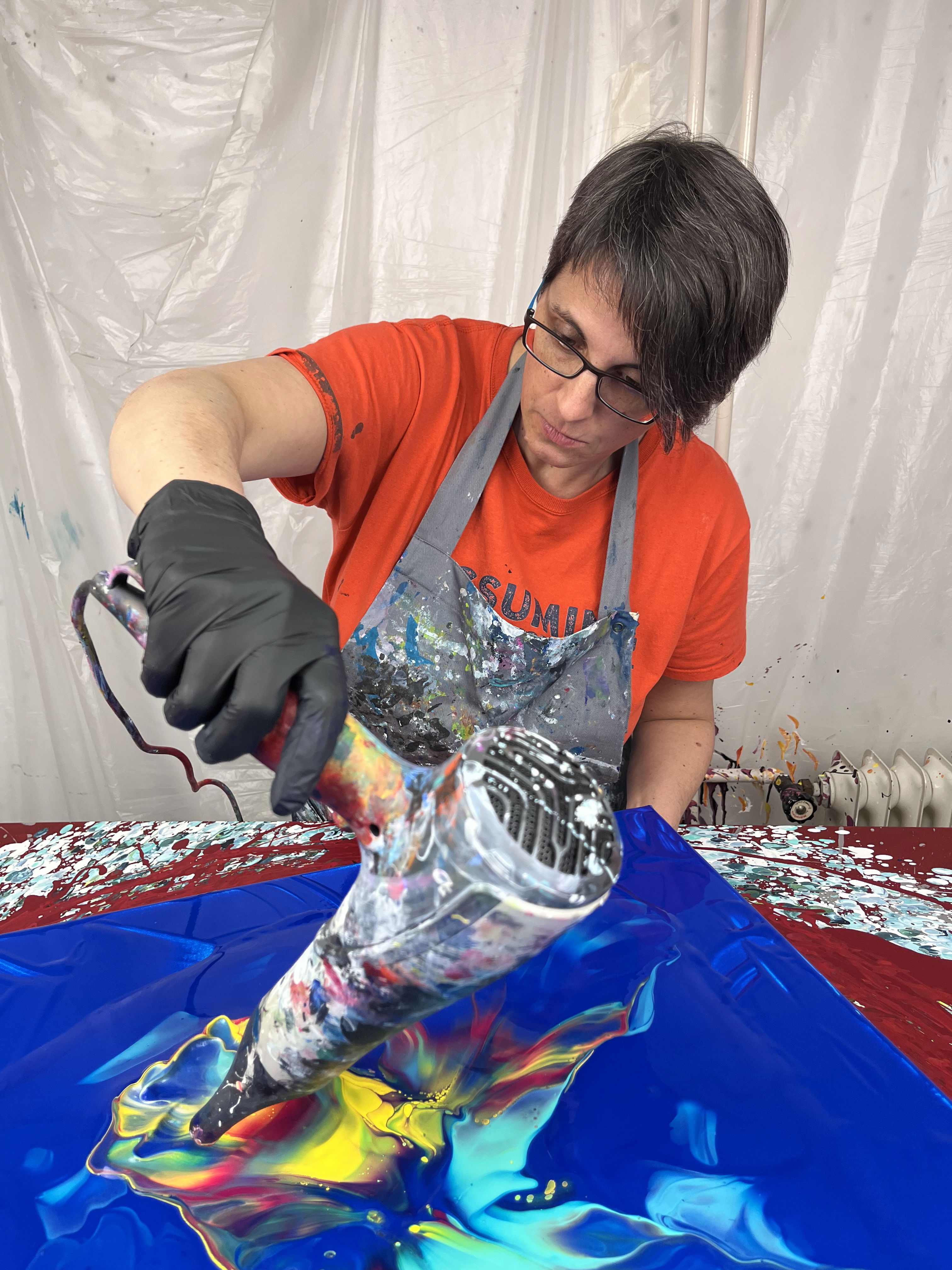 Full body image of the artist Dominique Ludmann in action.