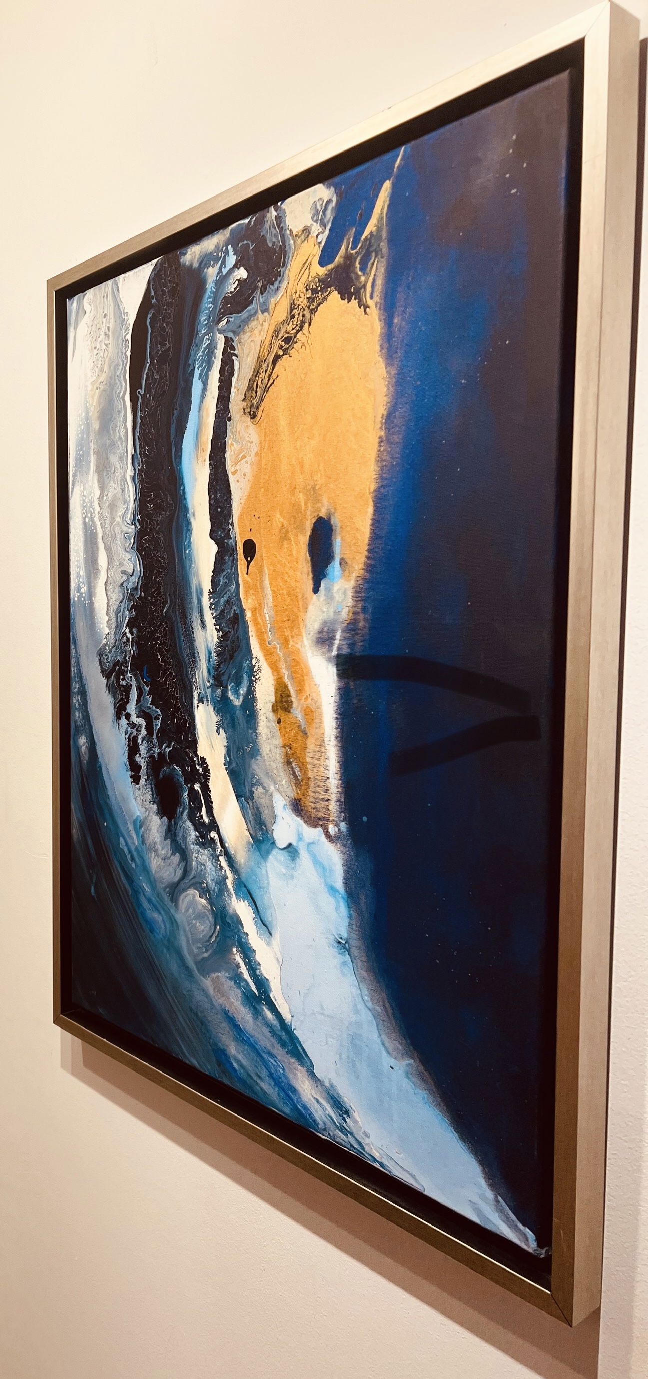 Abstract acrylic on canvas blending azure and obsidian in fluid streaks of celestial luminosity, depicting a golden tempest and the enigmatic depths of the cosmos. Artwork style - Abstrakt and technique Acryl auf Leinwand.