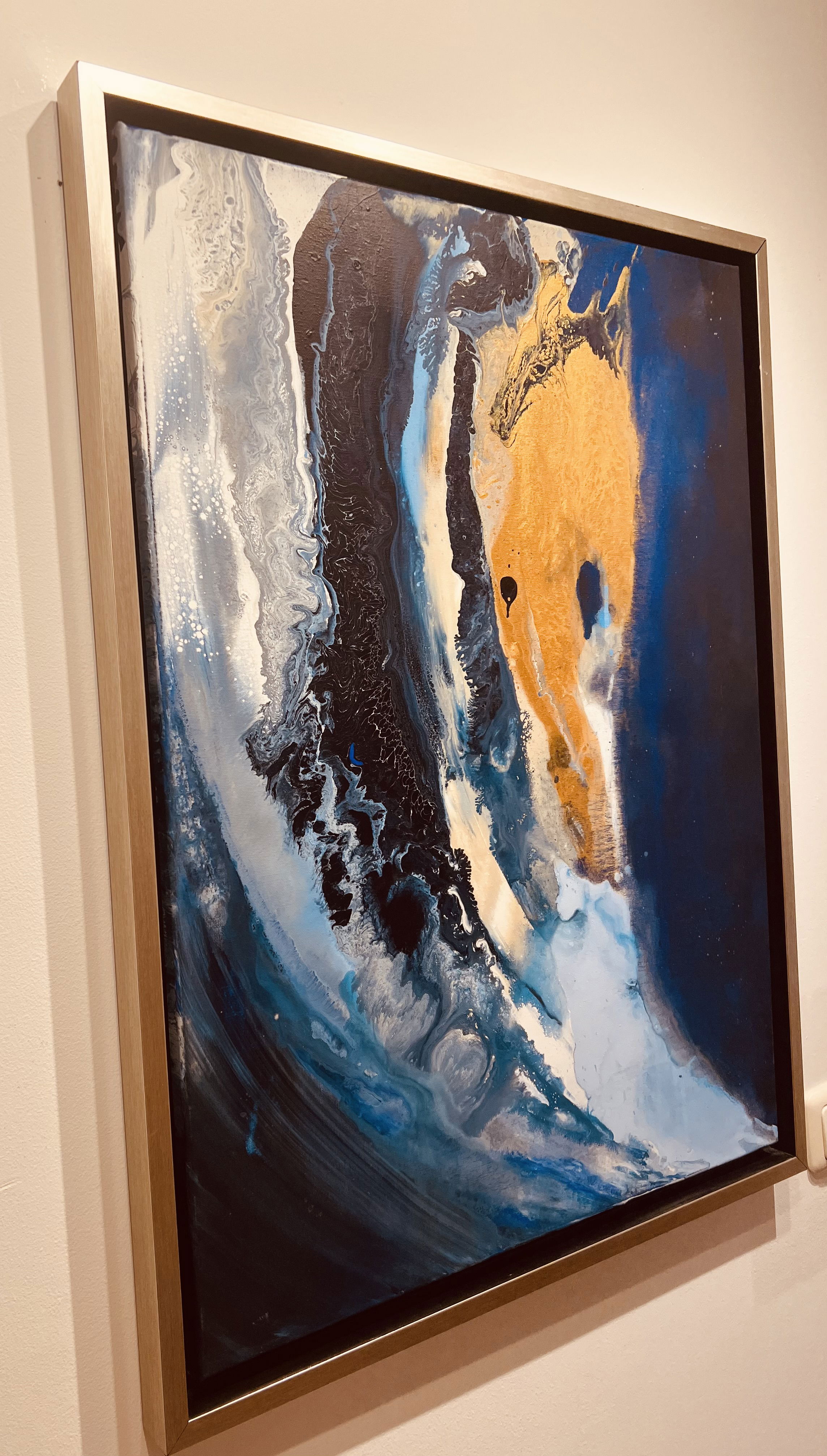 An abstract acrylic painting on canvas, featuring swirling azure and obsidian hues, interspersed with streaks of golden luminosity, evoking celestial fluidity and cosmic depth. Artwork style - Abstrakt and technique Acryl auf Leinwand.