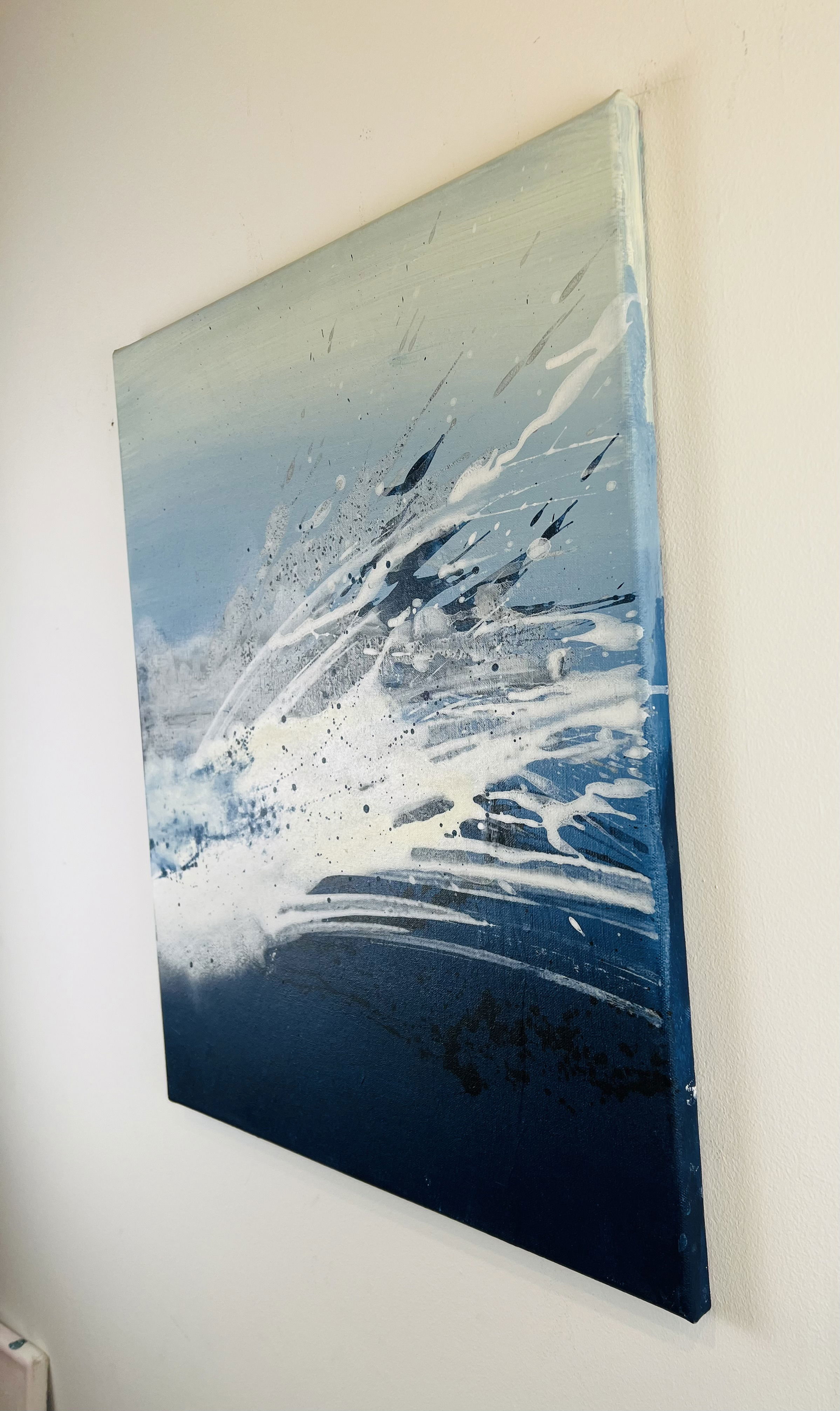 A dynamic acrylic painting on canvas; fluid blue and white splashes evoke the motion and intensity of ocean waves, capturing a mesmerizing dance of contrast and rhythm. Artwork style is Abstrakt and technique Acryl auf Leinwand.